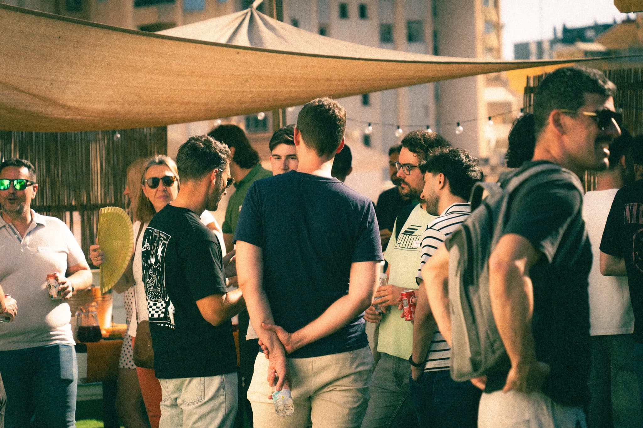 People talking on the terrace during a Cursor community event in Málaga